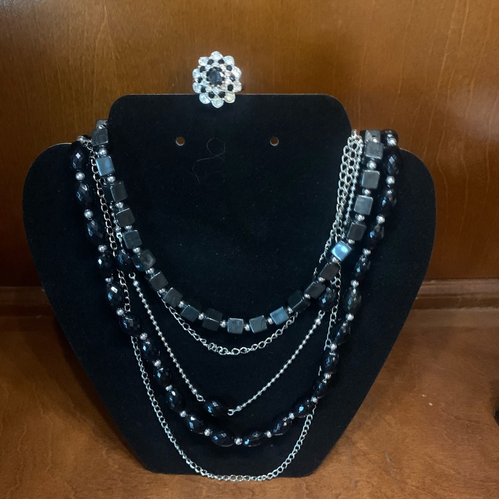Black bead and silver tone necklace with ring